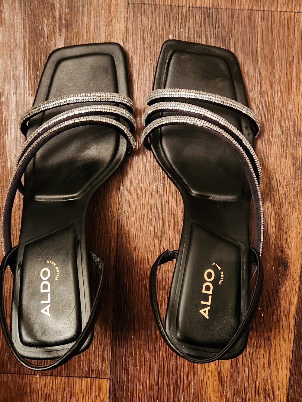 Aldo Astoria strappy heeled sandals in black with rhinestone embellishments.